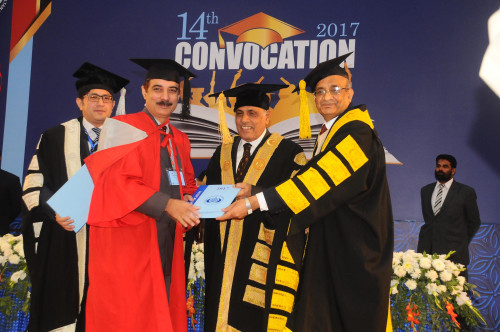 Dr. Amjad Bukhari receiving Ph. D. Degree from Governer Punjab